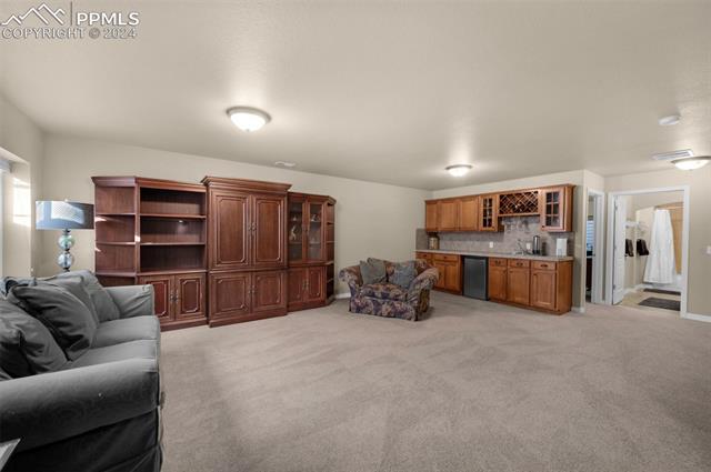 533 Talus Road Monument, CO 80132 - Photo 35 of 46 Carpeted living room with indoor bar