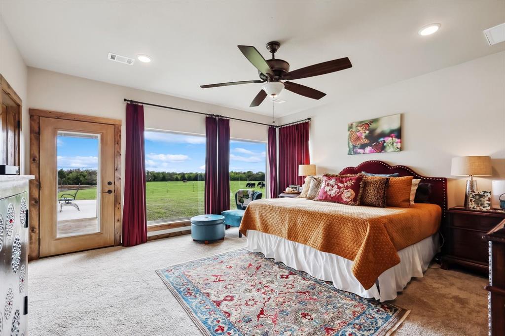 812 McKenzie Road Collinsville, TX 76233 - Photo 12 of 40 a bed room with a bed and a large window