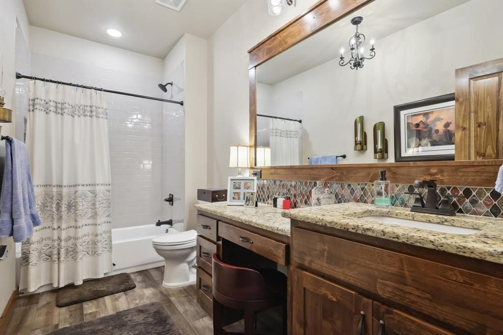 812 McKenzie Road Collinsville, TX 76233 - Photo 17 of 40 a bathroom with a granite countertop sink mirror and double
