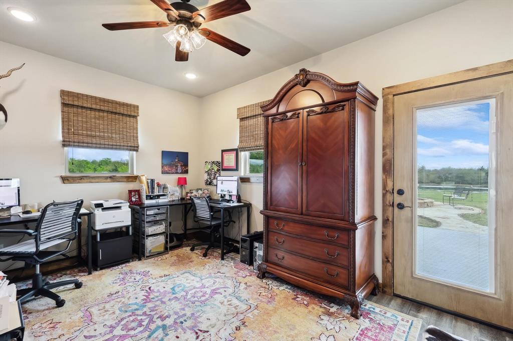 812 McKenzie Road Collinsville, TX 76233 - Photo 19 of 40 a view of a workspace with furniture and a window