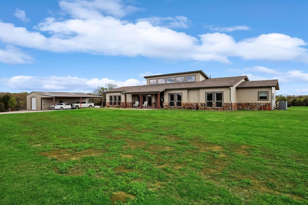 812 McKenzie Road Collinsville, TX 76233 - Photo 2 of 40 a view of a house with a yard