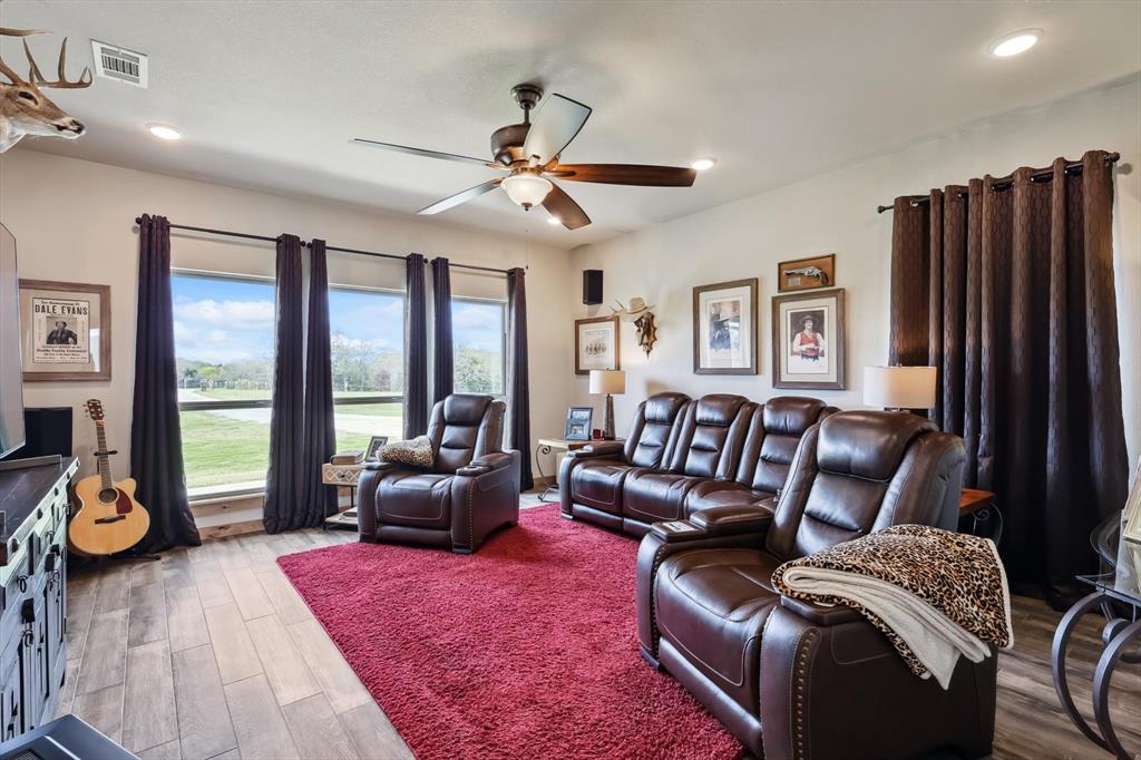 812 McKenzie Road Collinsville, TX 76233 - Photo 21 of 40 a living room with furniture and a floor to ceiling window