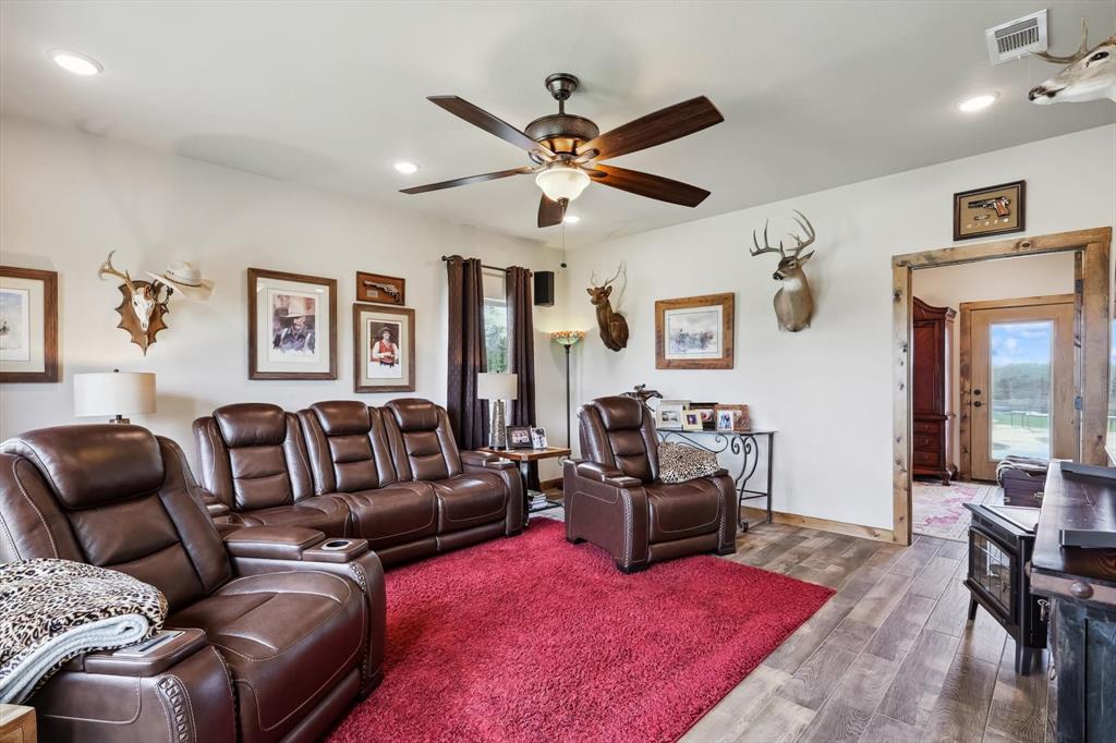 812 McKenzie Road Collinsville, TX 76233 - Photo 22 of 40 a living room with furniture ceiling fan and a rug