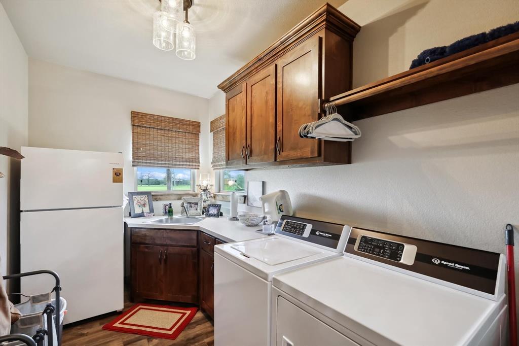 812 McKenzie Road Collinsville, TX 76233 - Photo 23 of 40 a kitchen with a refrigerator and a sink