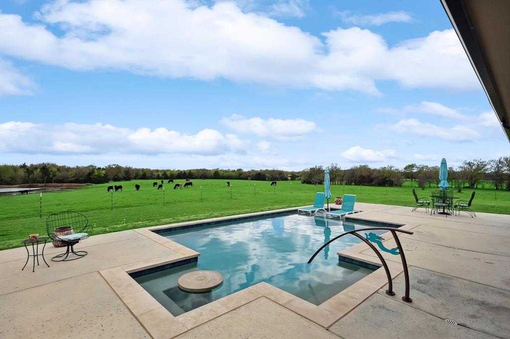 812 McKenzie Road Collinsville, TX 76233 - Photo 24 of 40 a view of swimming pool outdoor seating and green space