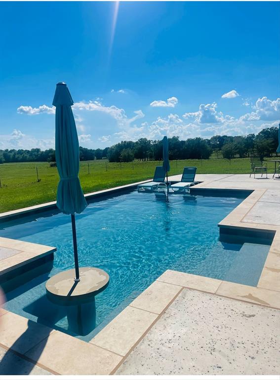 812 McKenzie Road Collinsville, TX 76233 - Photo 26 of 40 a view of a garden with swimming pool