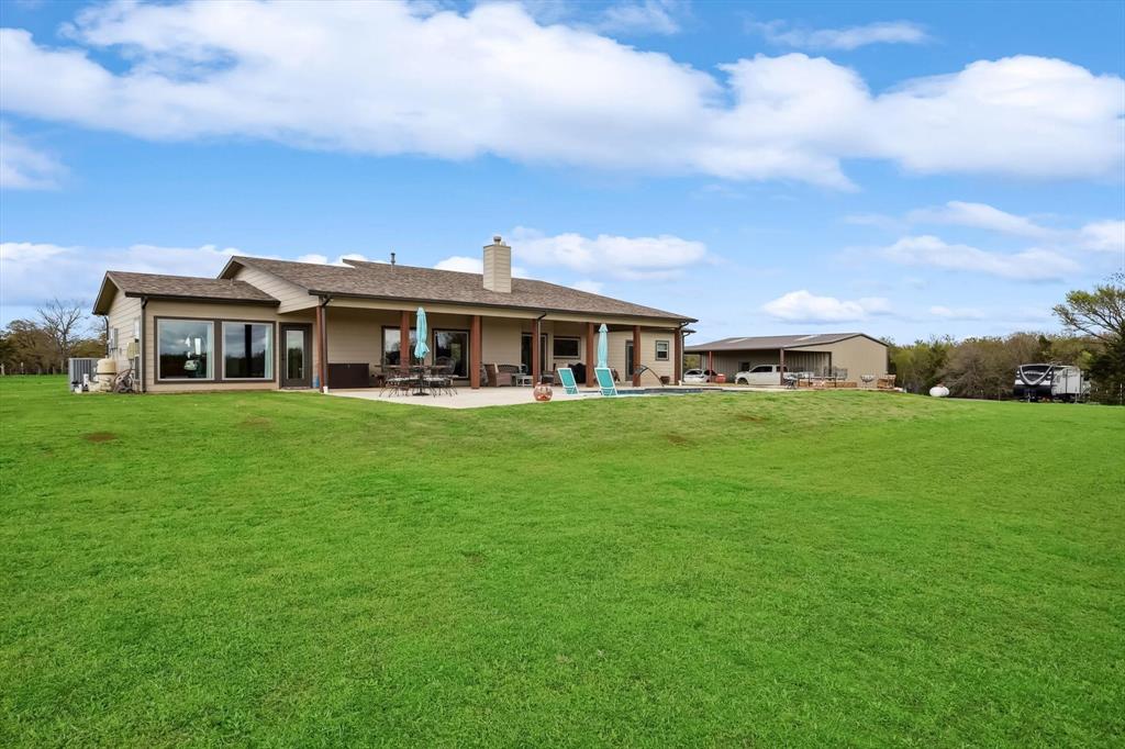 812 McKenzie Road Collinsville, TX 76233 - Photo 28 of 40 a front view of a house with a garden