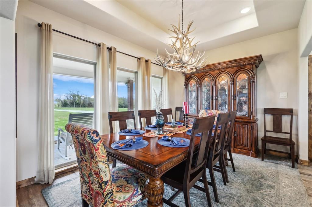 812 McKenzie Road Collinsville, TX 76233 - Photo 4 of 40 a view of a dining room with furniture window and wooden floor