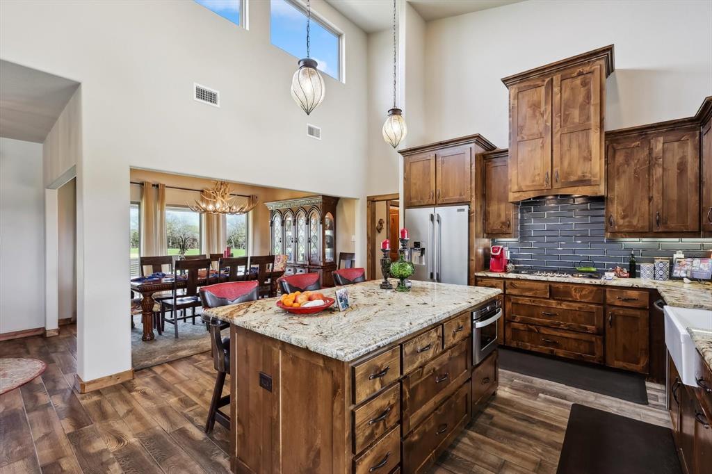 812 McKenzie Road Collinsville, TX 76233 - Photo 8 of 40 a open kitchen with a stove and large window