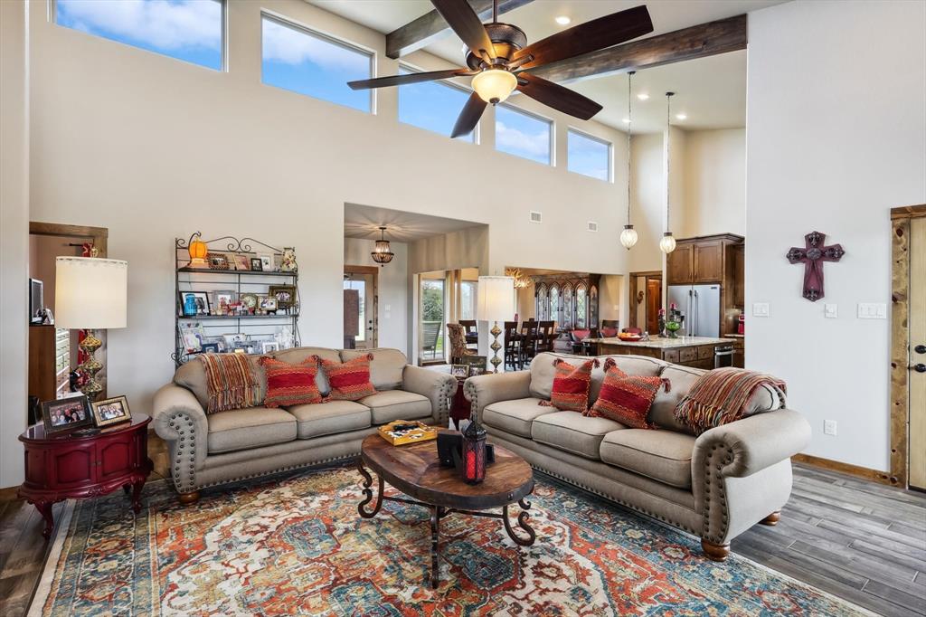 812 McKenzie Road Collinsville, TX 76233 - Photo 10 of 40 a living room with furniture a rug and a ceiling fan