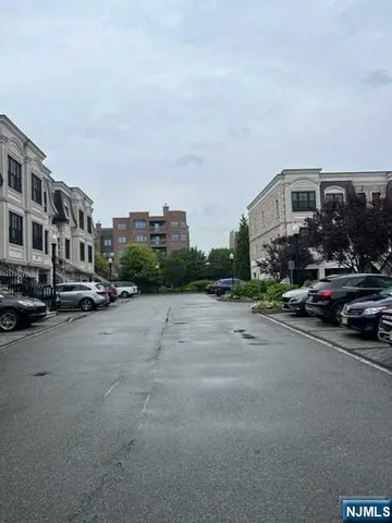 a view of a street in front of a building