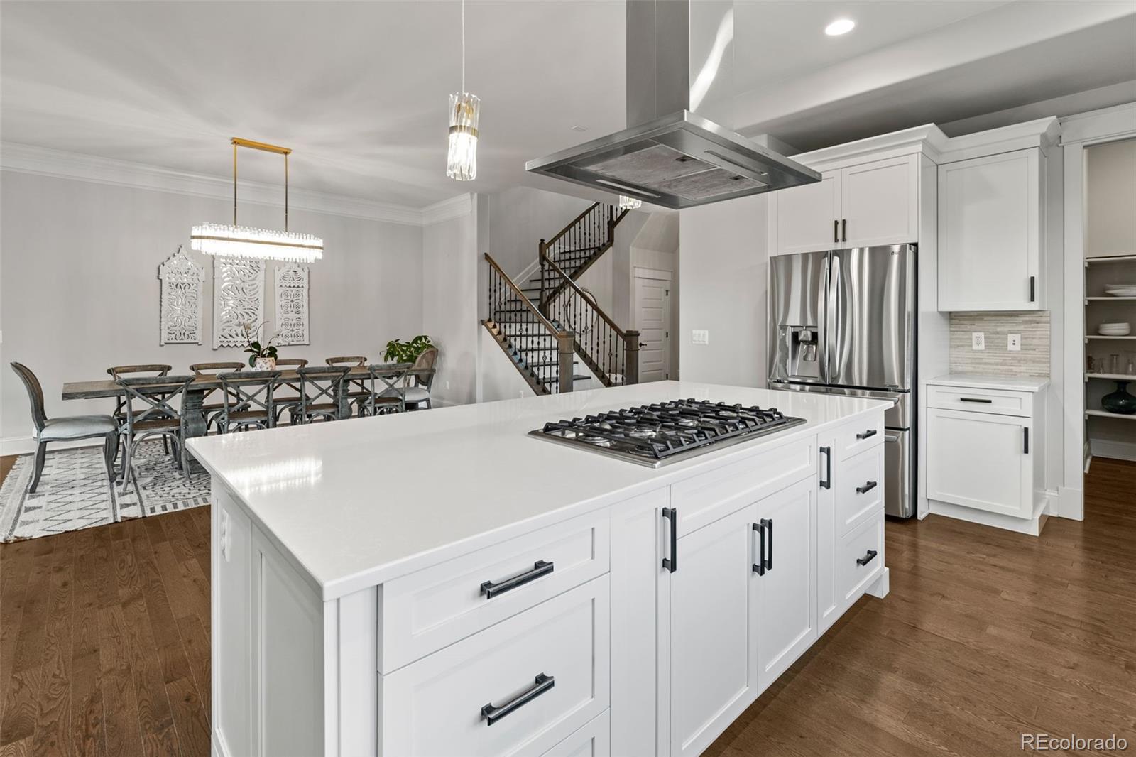 6003 Chester Way Denver, CO 80238 - Photo 11 of 43 a view of a kitchen counter space a sink stainless steel appliances and cabinets