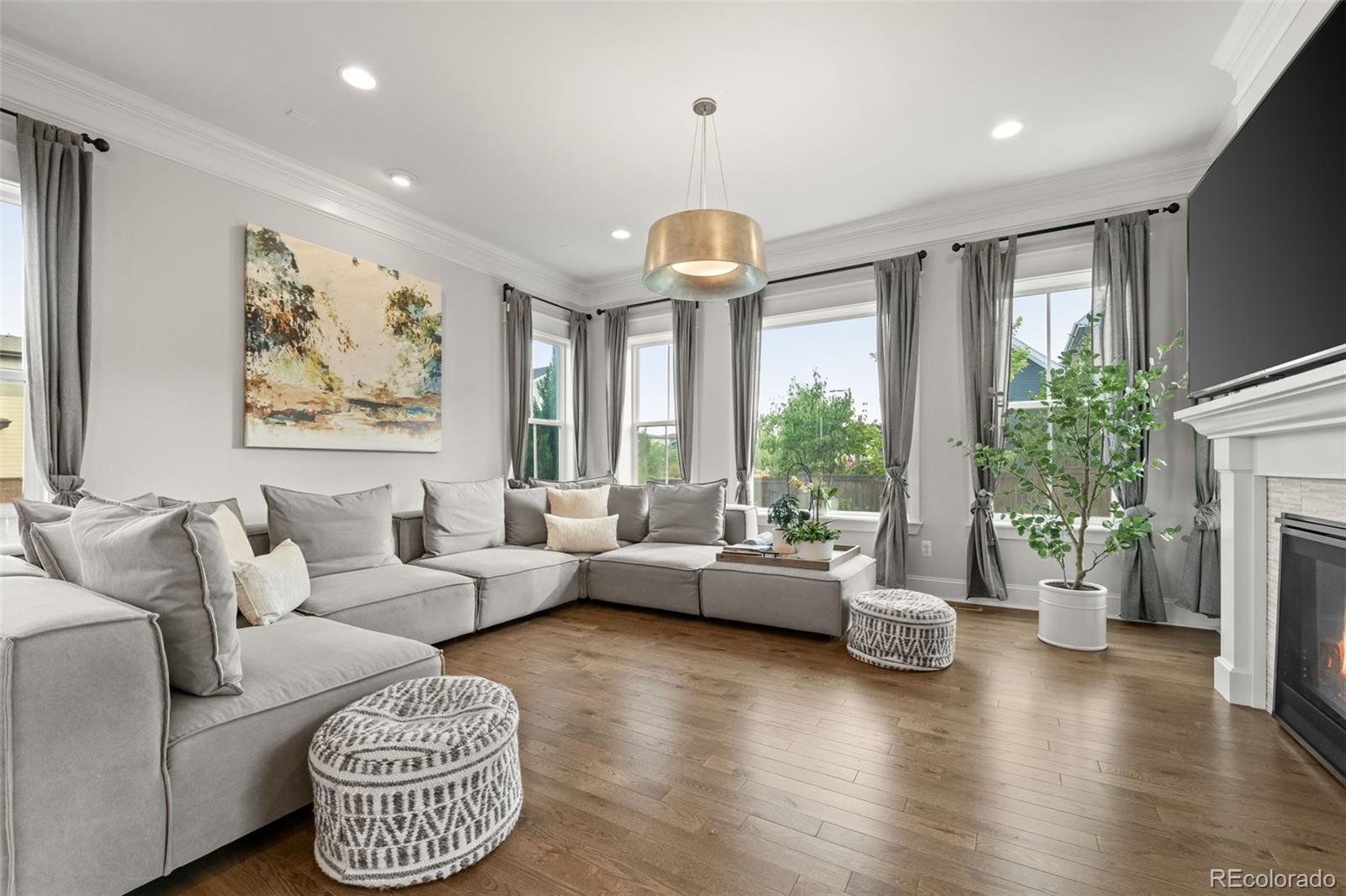 6003 Chester Way Denver, CO 80238 - Photo 12 of 43 a living room with furniture and a large window