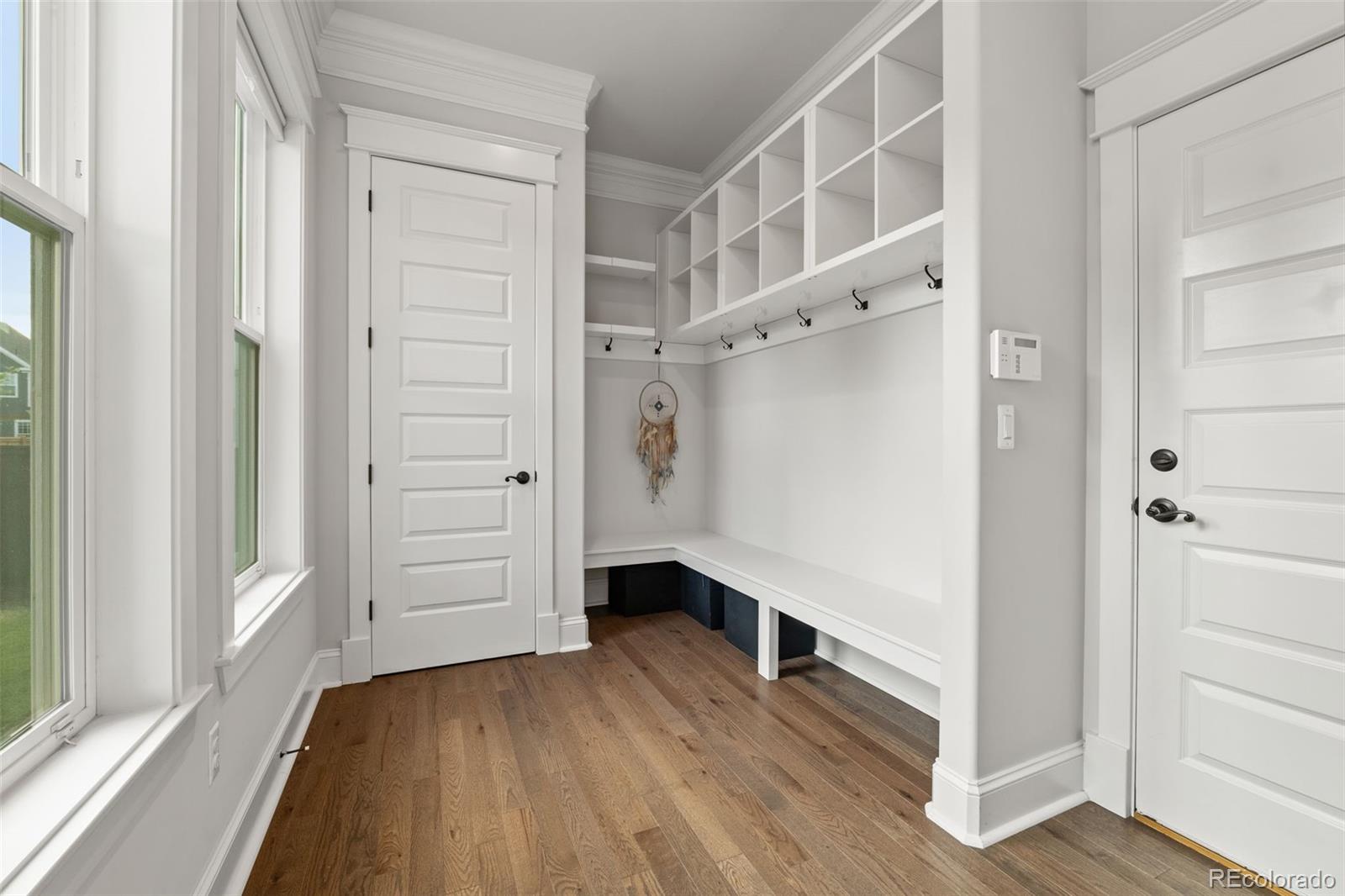 6003 Chester Way Denver, CO 80238 - Photo 15 of 43 a view of an entryway with wooden floor and staircase