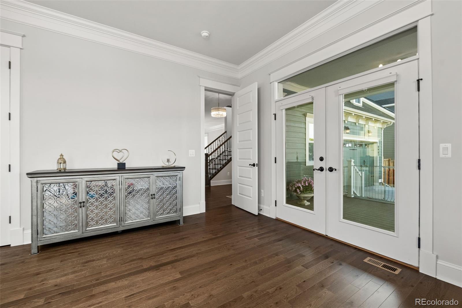 6003 Chester Way Denver, CO 80238 - Photo 16 of 43 a view of entryway with wooden floor