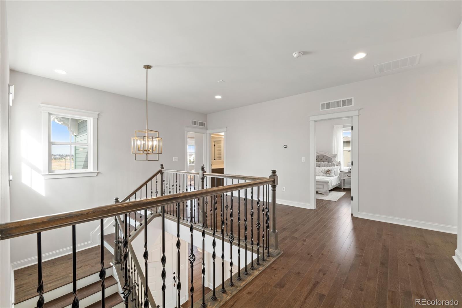6003 Chester Way Denver, CO 80238 - Photo 17 of 43 a view of empty room with wooden floor