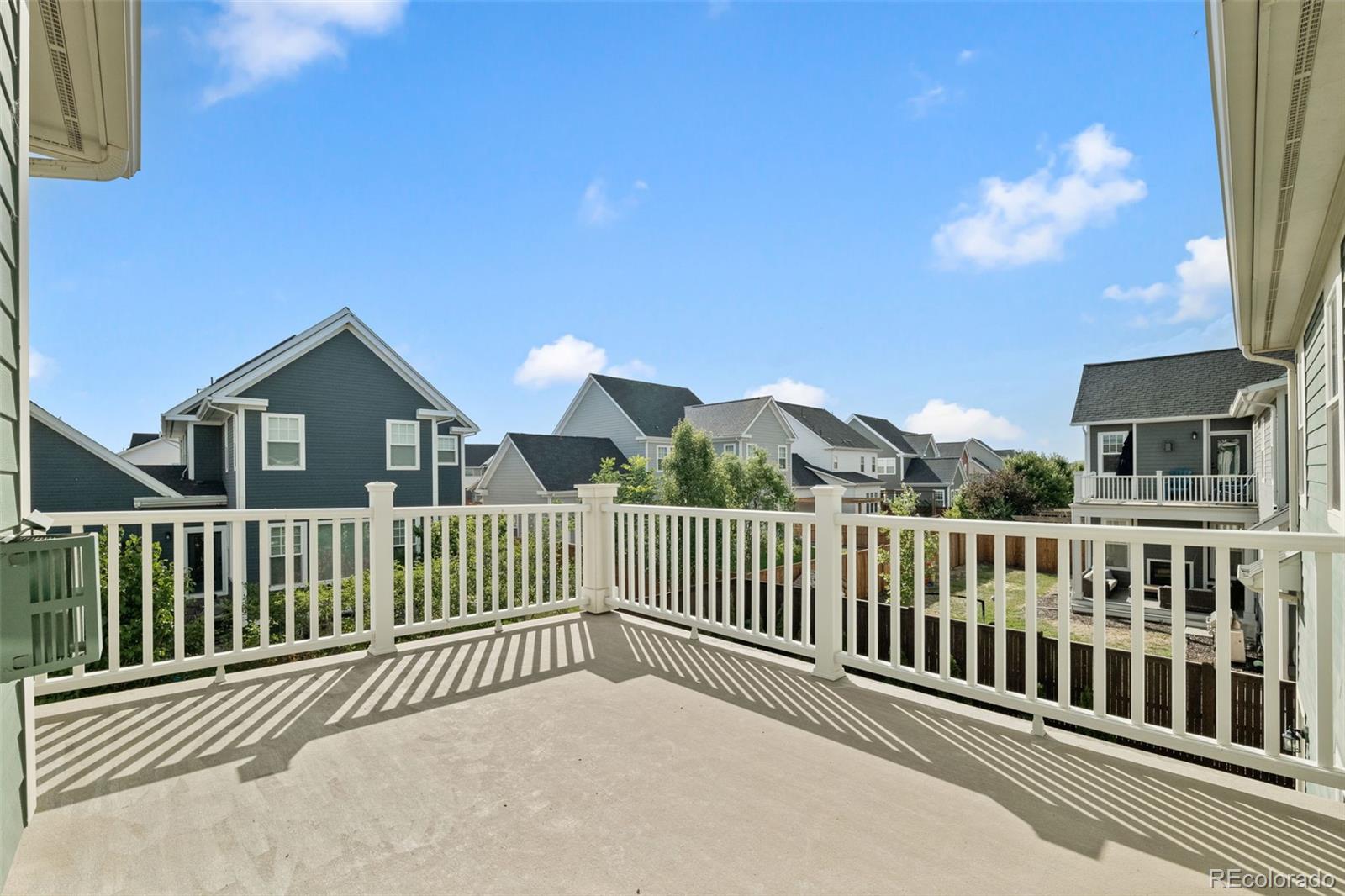 6003 Chester Way Denver, CO 80238 - Photo 21 of 43 a view of a houses with a balcony