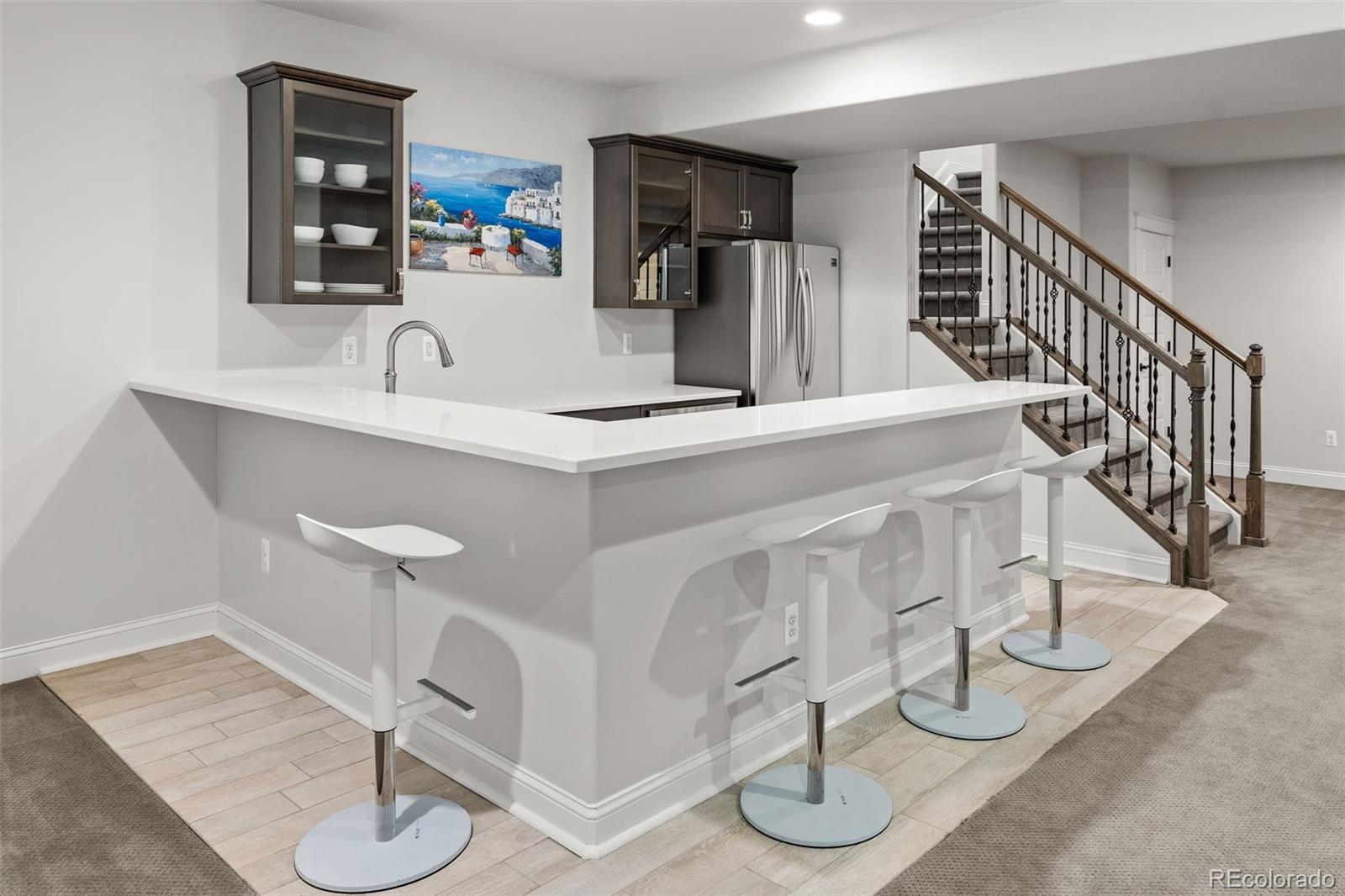 6003 Chester Way Denver, CO 80238 - Photo 30 of 43 a kitchen with a sink cabinets and appliances