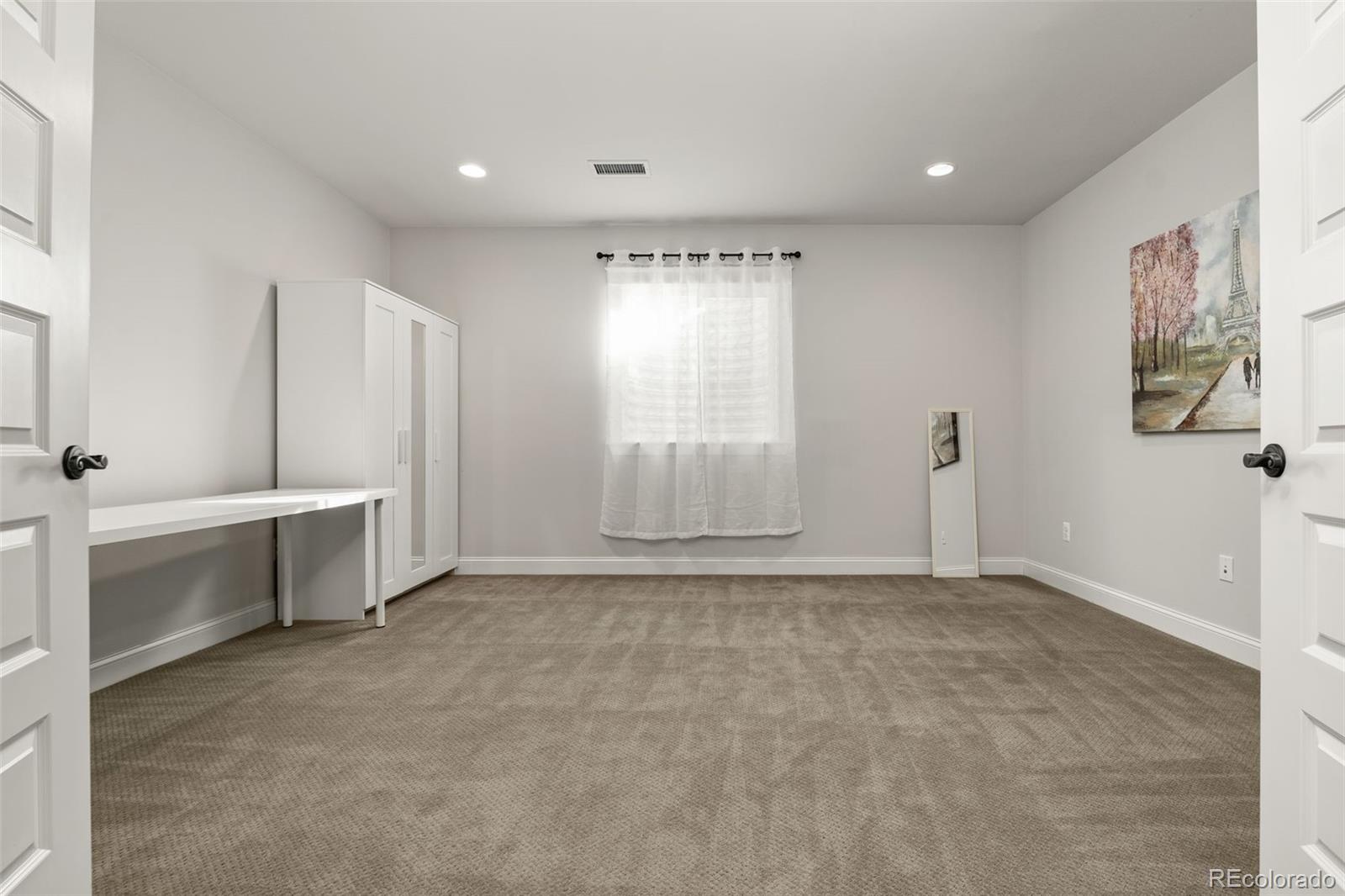 6003 Chester Way Denver, CO 80238 - Photo 31 of 43 a view of an empty room with a window