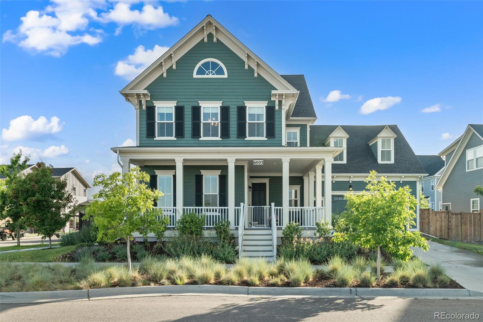 6003 Chester Way Denver, CO 80238 - Photo 40 of 43 a front view of a house with a yard