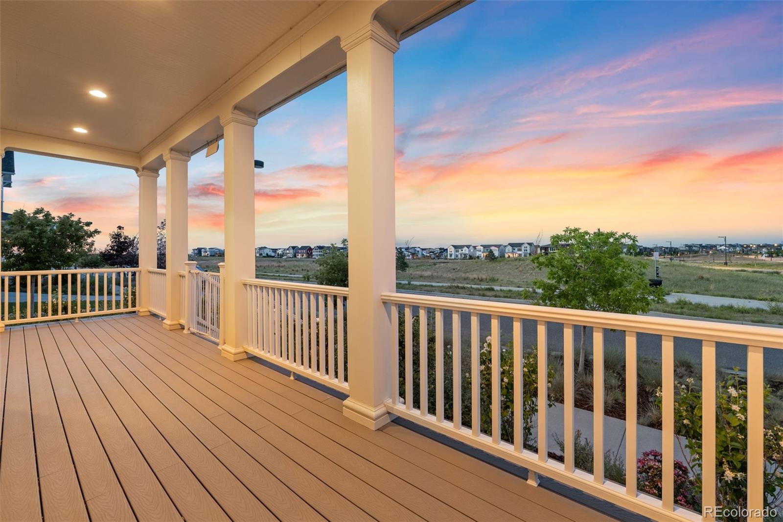 6003 Chester Way Denver, CO 80238 - Photo 6 of 43 a view of deck with wooden floor and fence