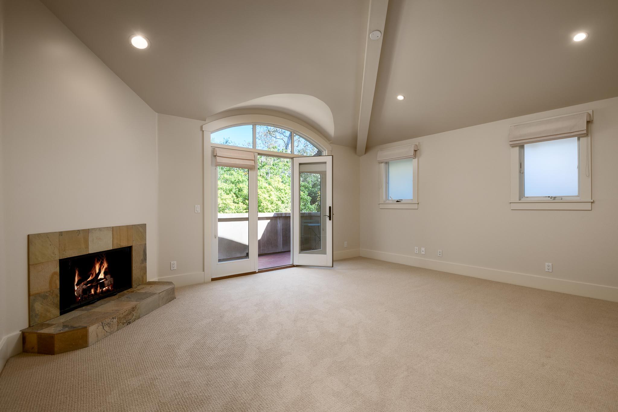 1517 East Valley Road, Unit B Montecito, CA 93108 - Photo 17 of 25 an empty room with fireplace and windows