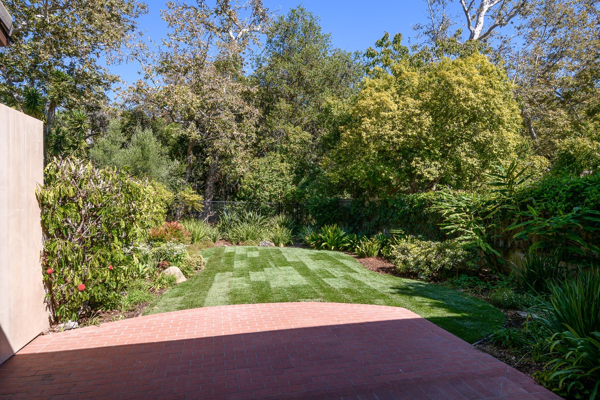 1517 East Valley Road, Unit B Montecito, CA 93108 - Photo 9 of 25 a view of a yard with plants and a tree
