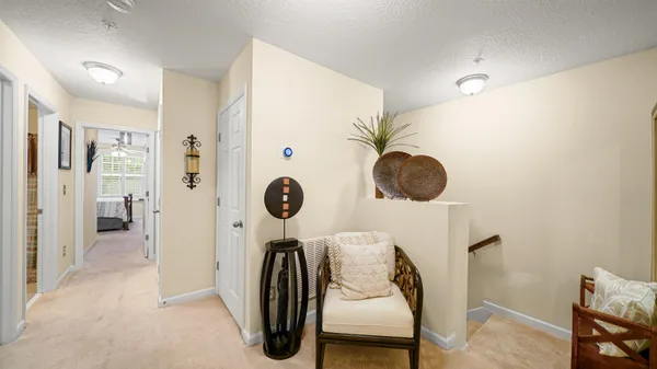 a hallway with a washer and dryer