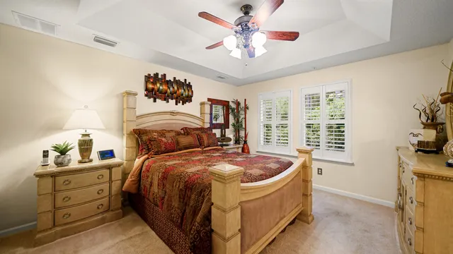 a bed room with a bed and a chandelier