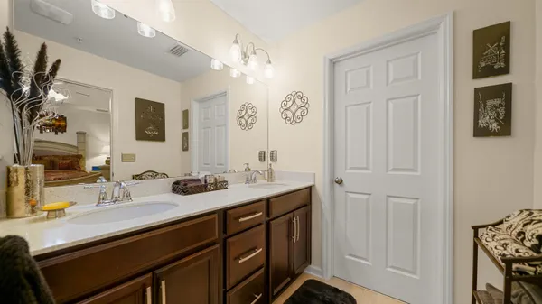 a bathroom with a sink double vanity and a mirror