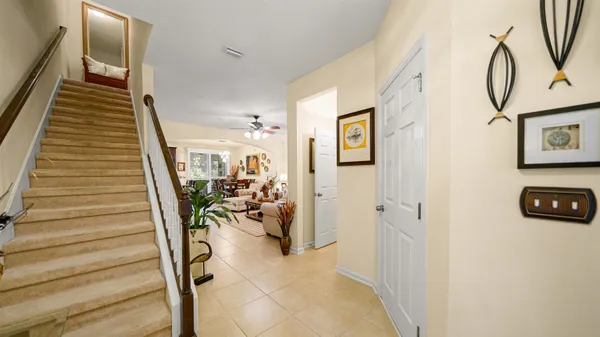 a view of a livingroom with furniture and stairs