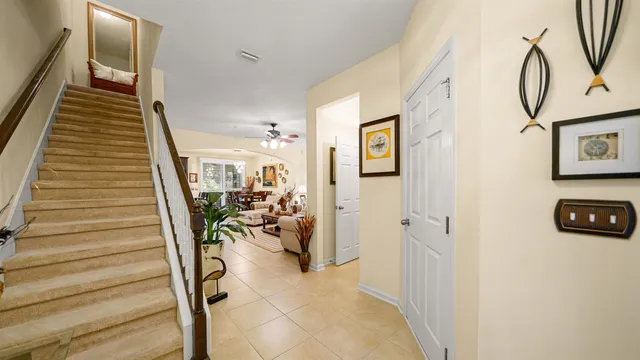 a view of a livingroom with furniture and stairs