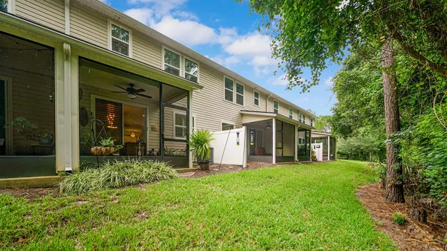 a view of a house with a yard porch and sitting area