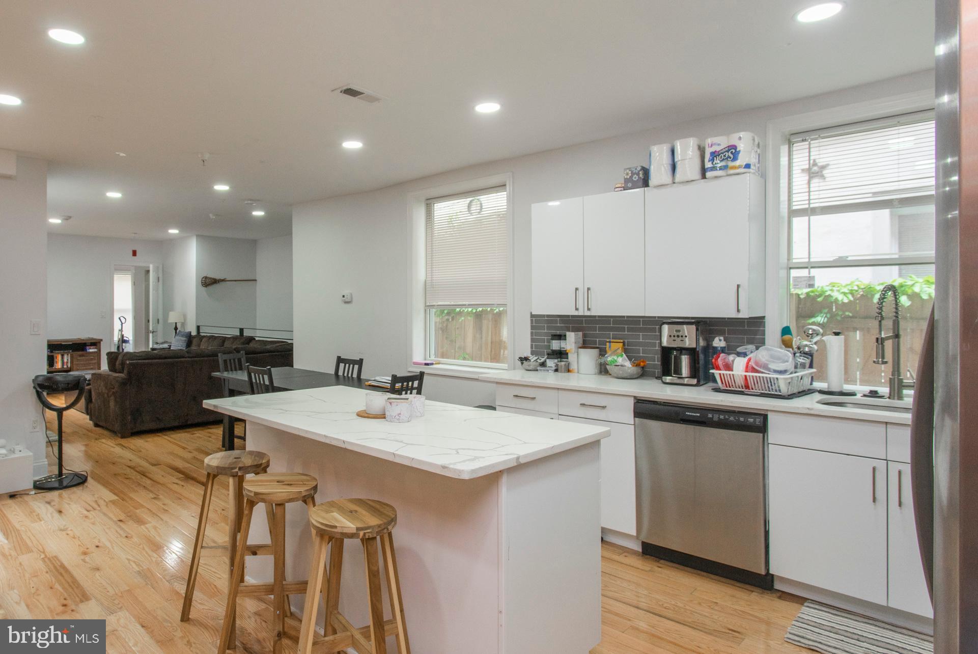 1629 Wallace Street, Unit 1R Philadelphia, PA 19130 - Photo 11 of 22 a kitchen with a sink stove and cabinets