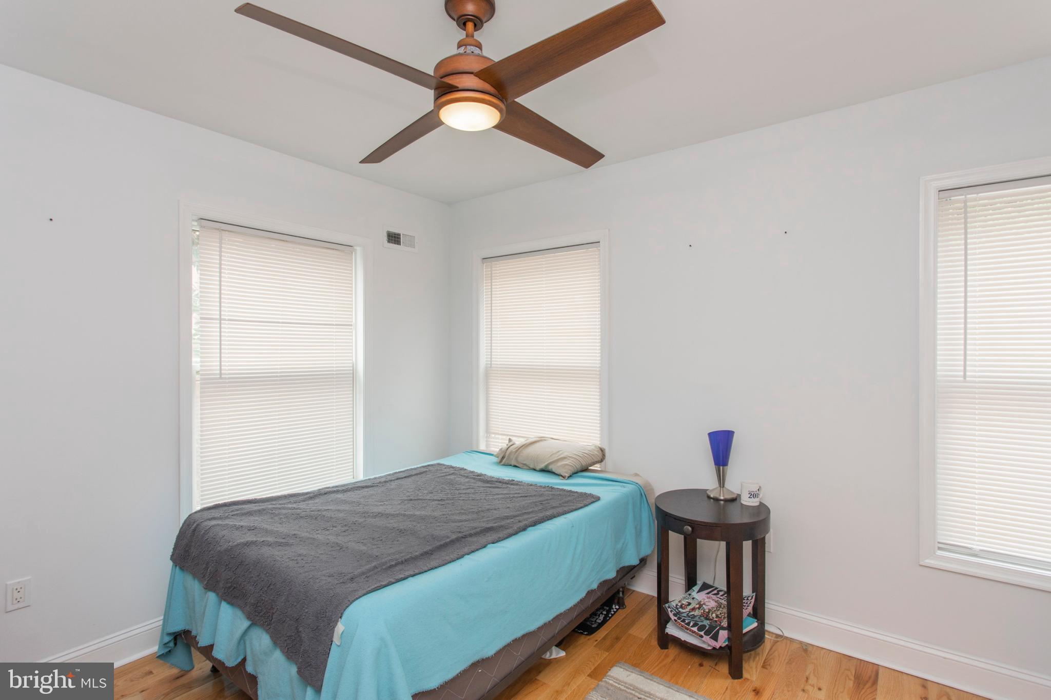 1629 Wallace Street, Unit 1R Philadelphia, PA 19130 - Photo 19 of 22 a bedroom with a bed and a window