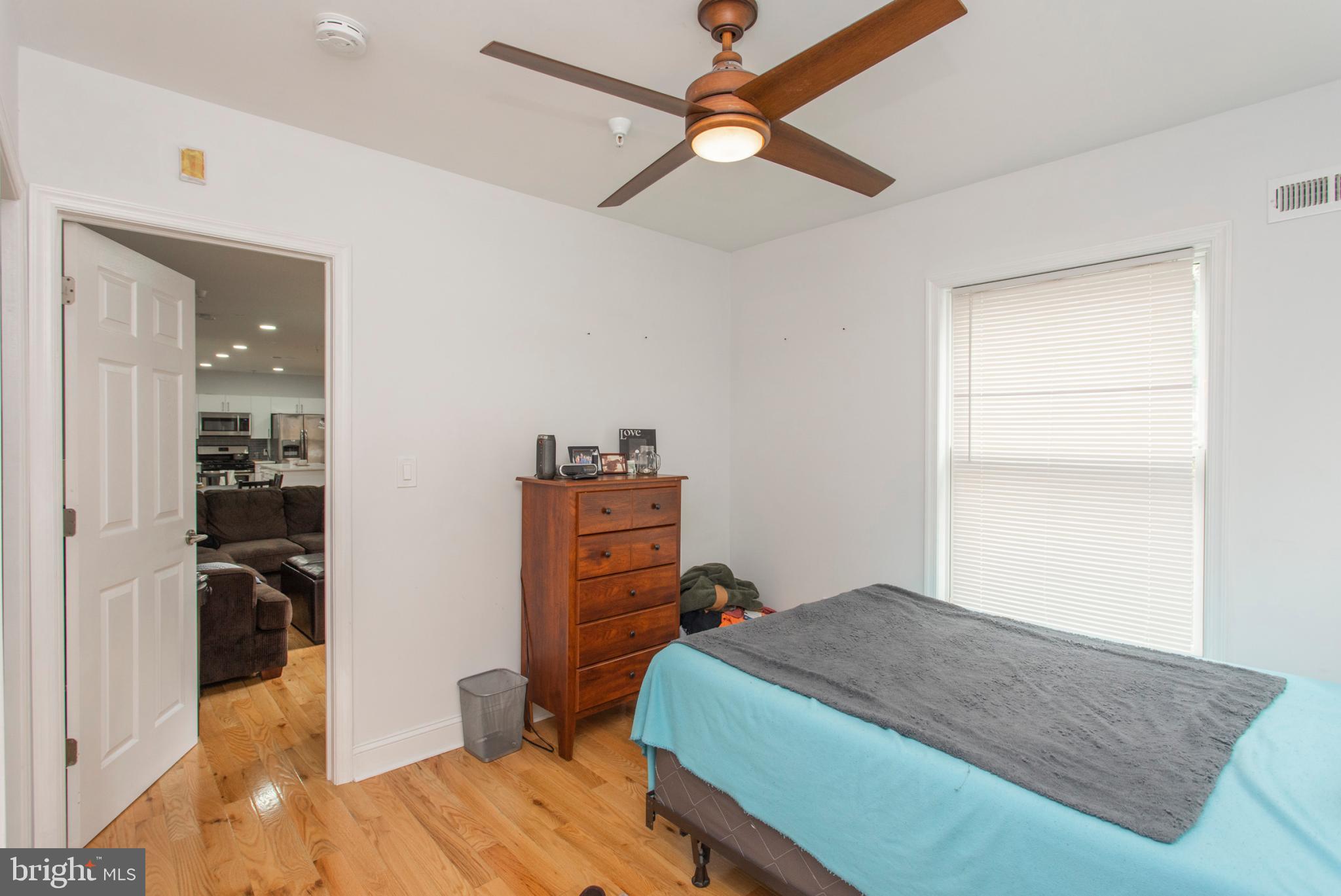 1629 Wallace Street, Unit 1R Philadelphia, PA 19130 - Photo 20 of 22 a bedroom with a bed and a dresser