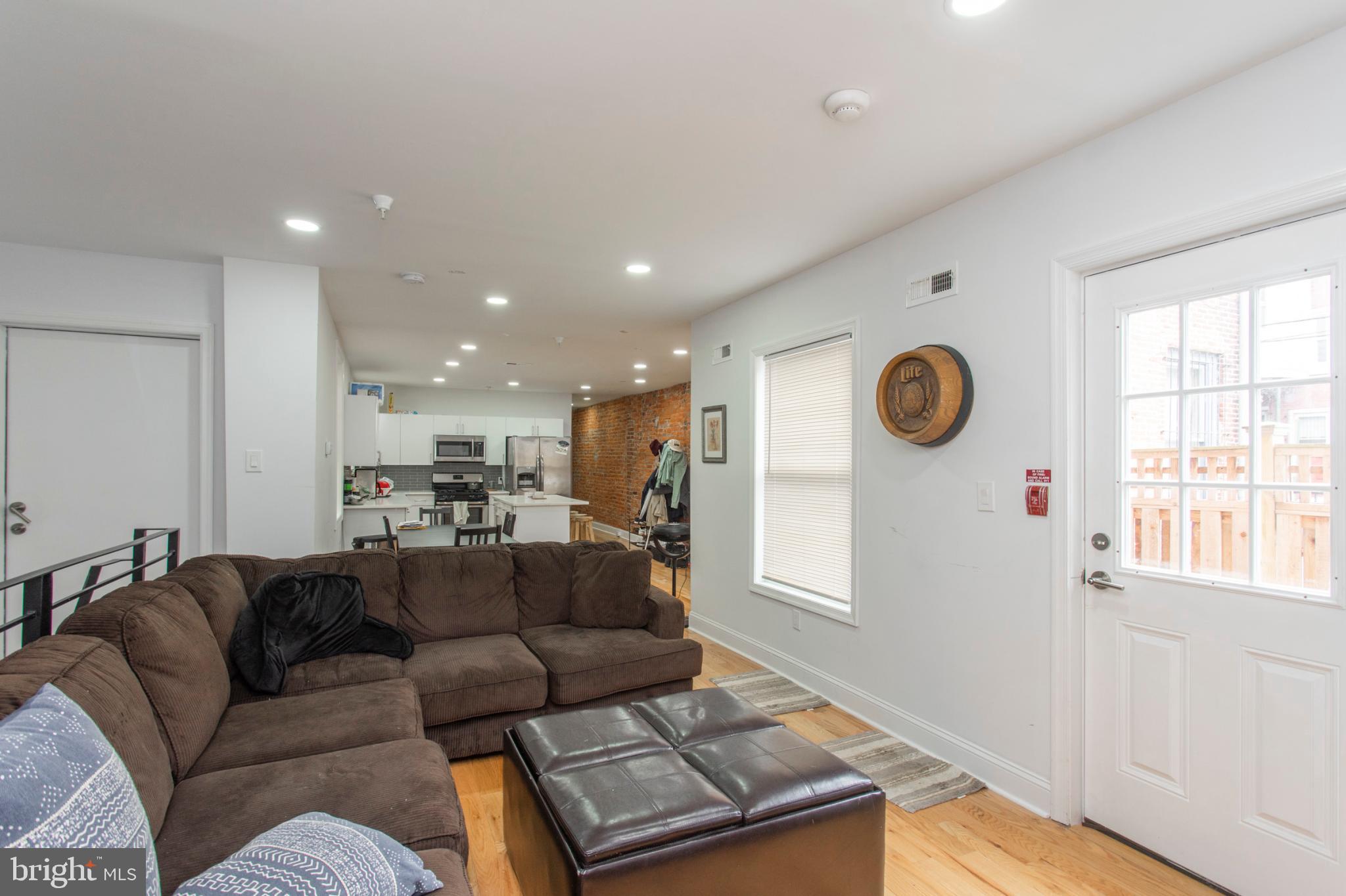 1629 Wallace Street, Unit 1R Philadelphia, PA 19130 - Photo 4 of 22 a living room with furniture and a window