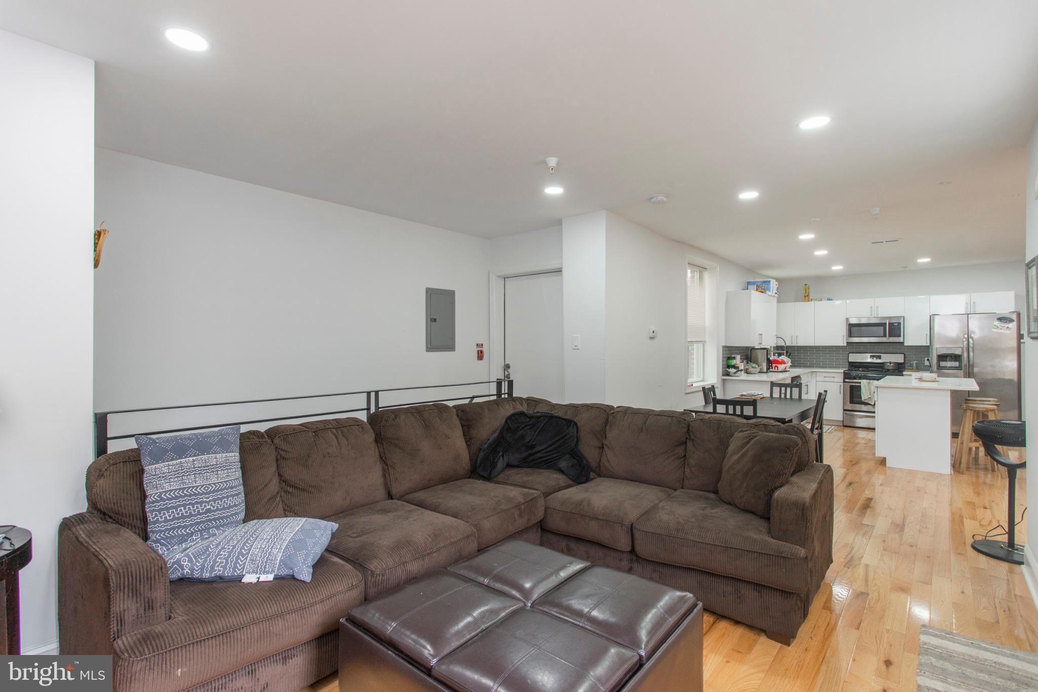 1629 Wallace Street, Unit 1R Philadelphia, PA 19130 - Photo 5 of 22 a living room with furniture and a couch