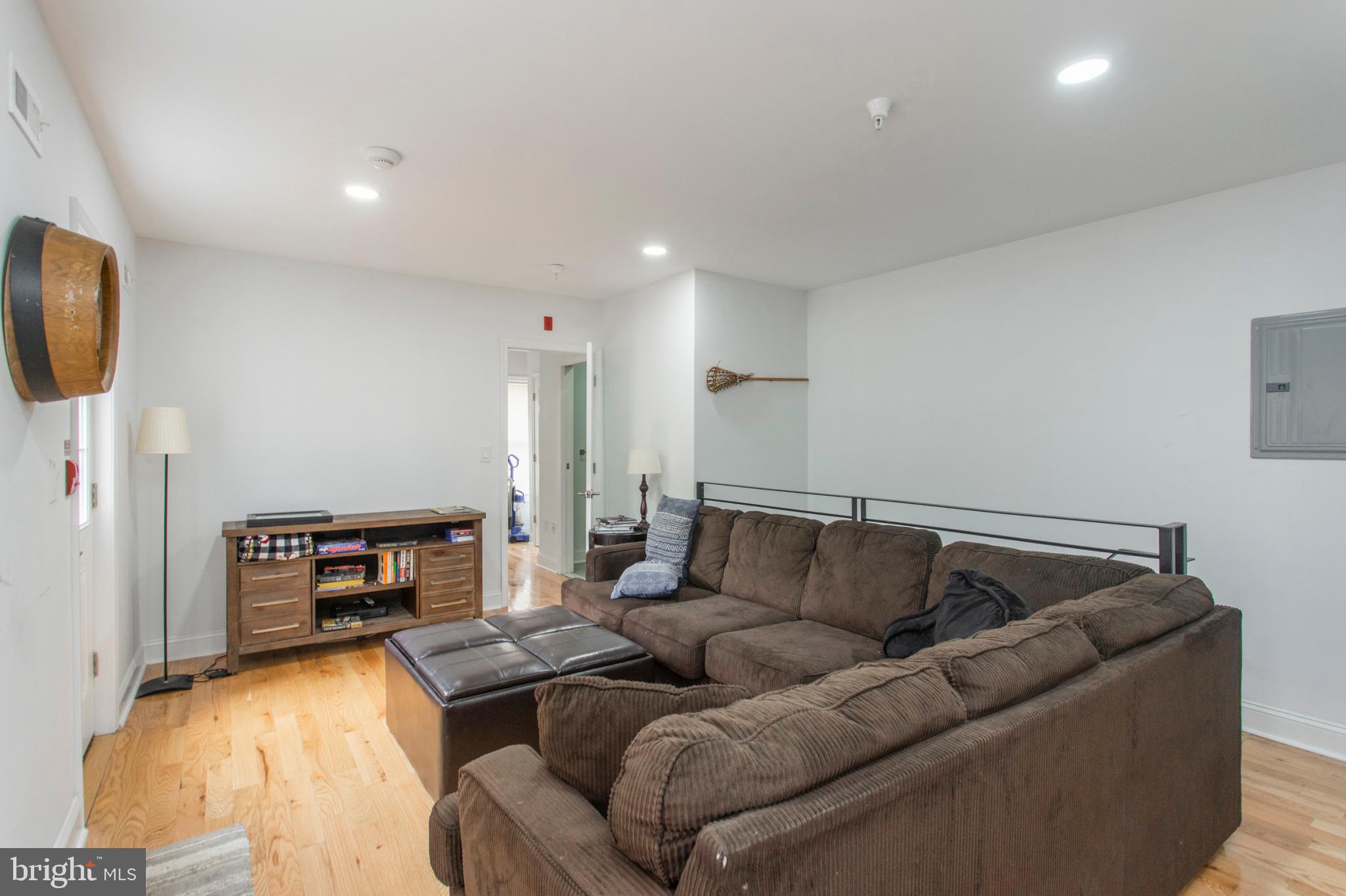 1629 Wallace Street, Unit 1R Philadelphia, PA 19130 - Photo 6 of 22 a living room with furniture and a fireplace