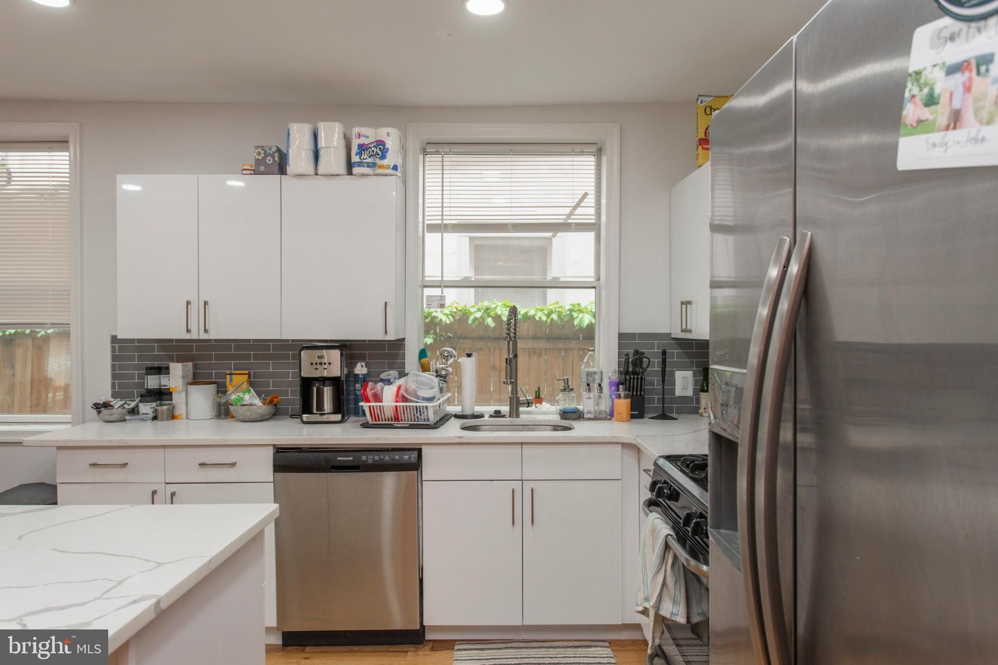 1629 Wallace Street, Unit 1R Philadelphia, PA 19130 - Photo 10 of 22 a kitchen with a sink appliances cabinets and a window