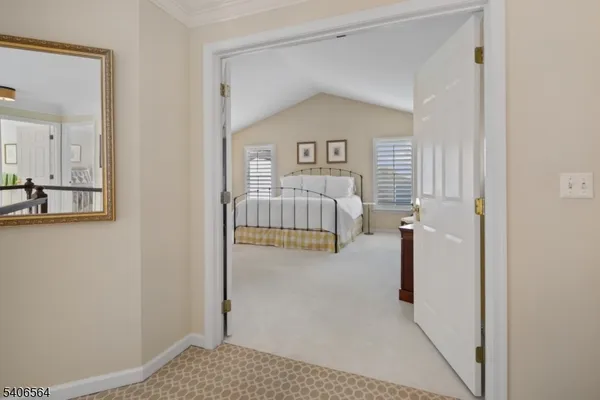 a spacious bedroom with a bed and furniture