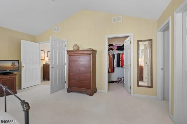 a view of a hallway with closet area