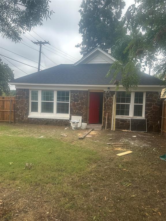 2435 Romine Avenue Dallas, TX 75215 - Photo 3 of 17 Back of house featuring stone siding and a shingled roof