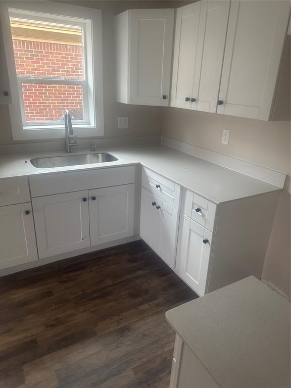 2435 Romine Avenue Dallas, TX 75215 - Photo 8 of 17 Kitchen with white cabinetry and dark wood-type flooring