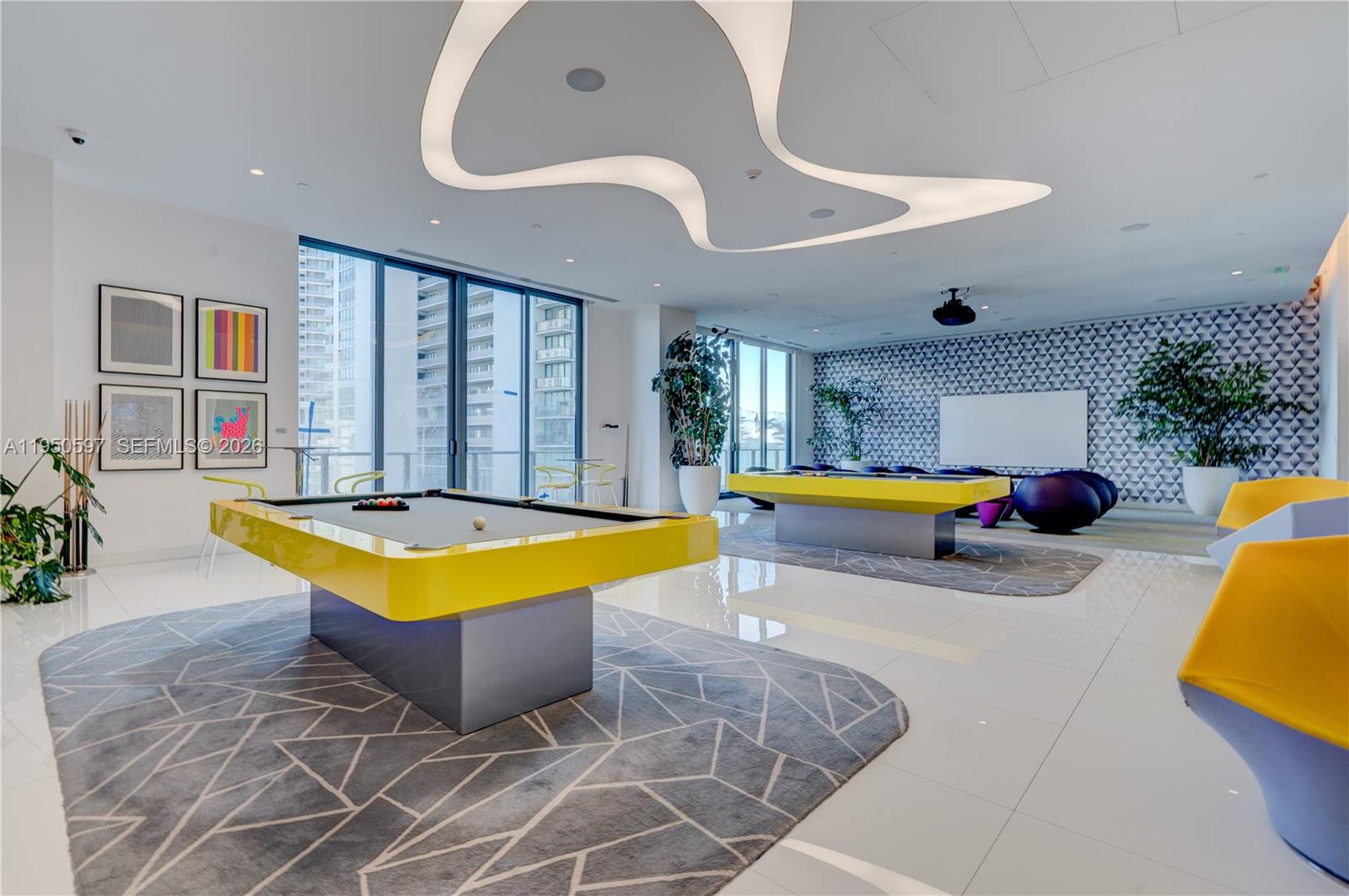 501 Northeast 31st Street, Unit 706 Miami, FL 33137 - Photo 16 of 24 a swimming pool with outdoor seating and yard