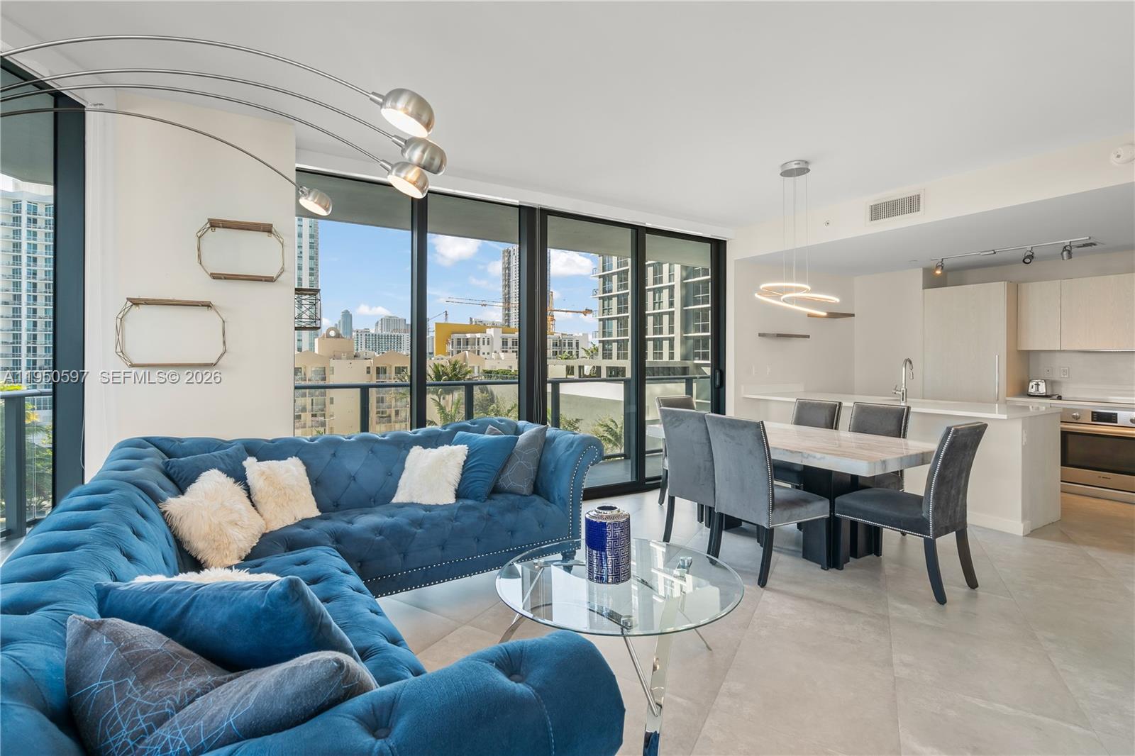 501 Northeast 31st Street, Unit 706 Miami, FL 33137 - Photo 5 of 24 a living room with furniture and a large window