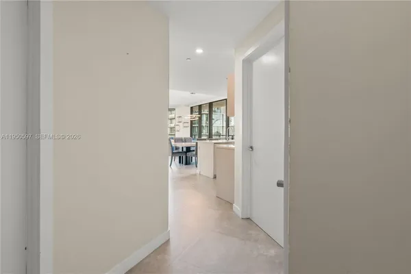 a view of a hallway with wooden shelves