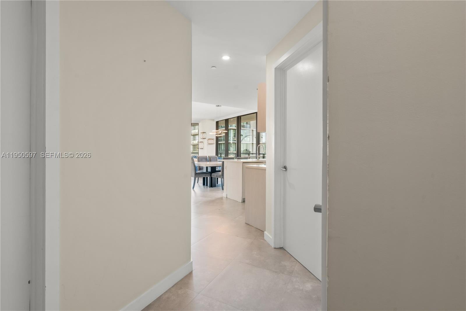 501 Northeast 31st Street, Unit 706 Miami, FL 33137 - Photo 8 of 24 a view of a hallway with wooden shelves