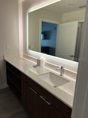 a bathroom with a sink double vanity and a mirror