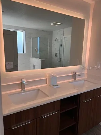 a bathroom with a sink and a mirror